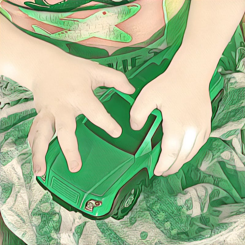 Rendered photograph of a light-skinned child’s hands holding a green toy car.