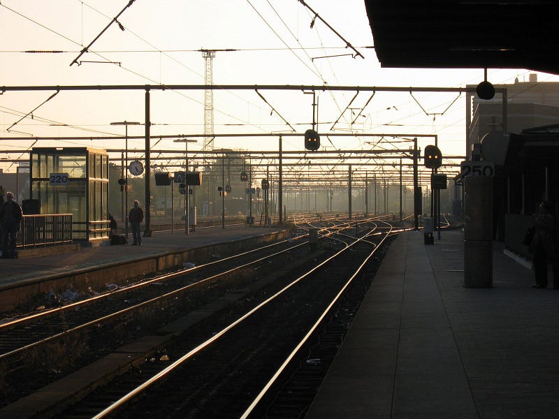 train station tracks at sunset