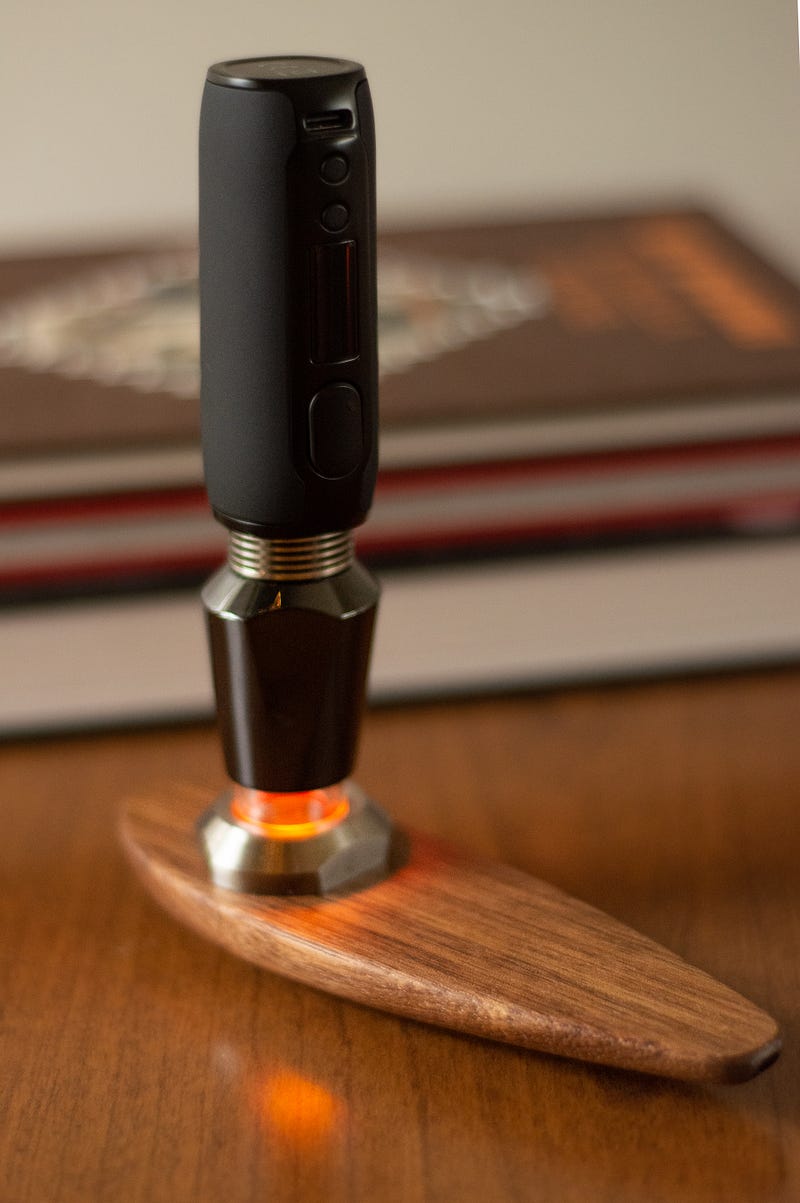 The Prrl Labs Neo glowing on a Terp Surfer in front of books