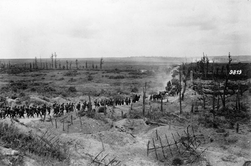 “German soldiers advancing past a captured French position, between Loivre and Brimont, Marne department, 1918”