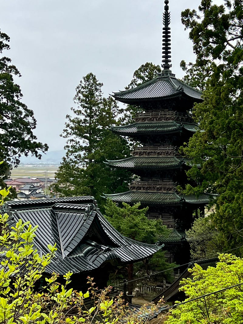 My first adventure of the day took me to a five-story pagoda rising over a temple complex in the rain.