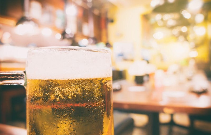 A budget traveler enjoys a draft beer for cheap in Japan