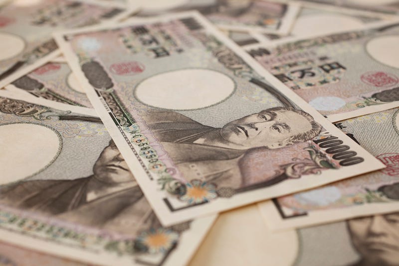 A tourist traveling in the Japanese countryside carries extra cash with them just in case