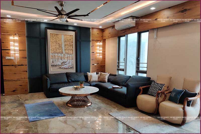 luxurious living area with chairs and fan and a and a sliding window