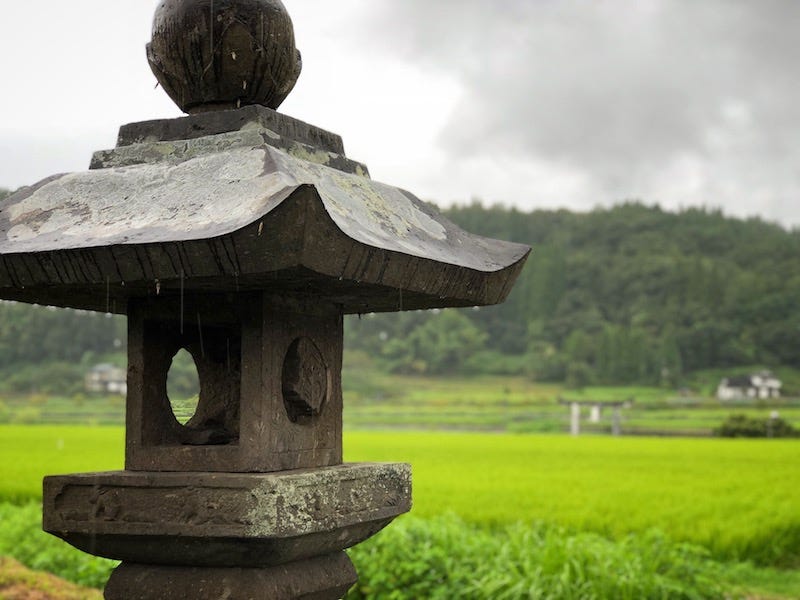 A stone lantern in the middle of one of Bungo-Ono’s rice fields in Oita Prefecture