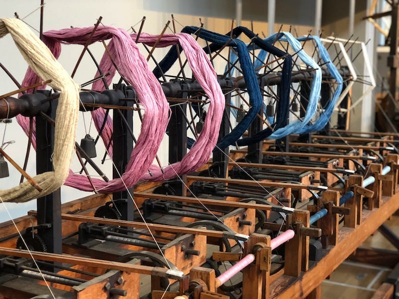 Old spinning wheels from Toyota’s initial business are on display at Toyota Commemorative Museum of Industry and Technology in Nagoya