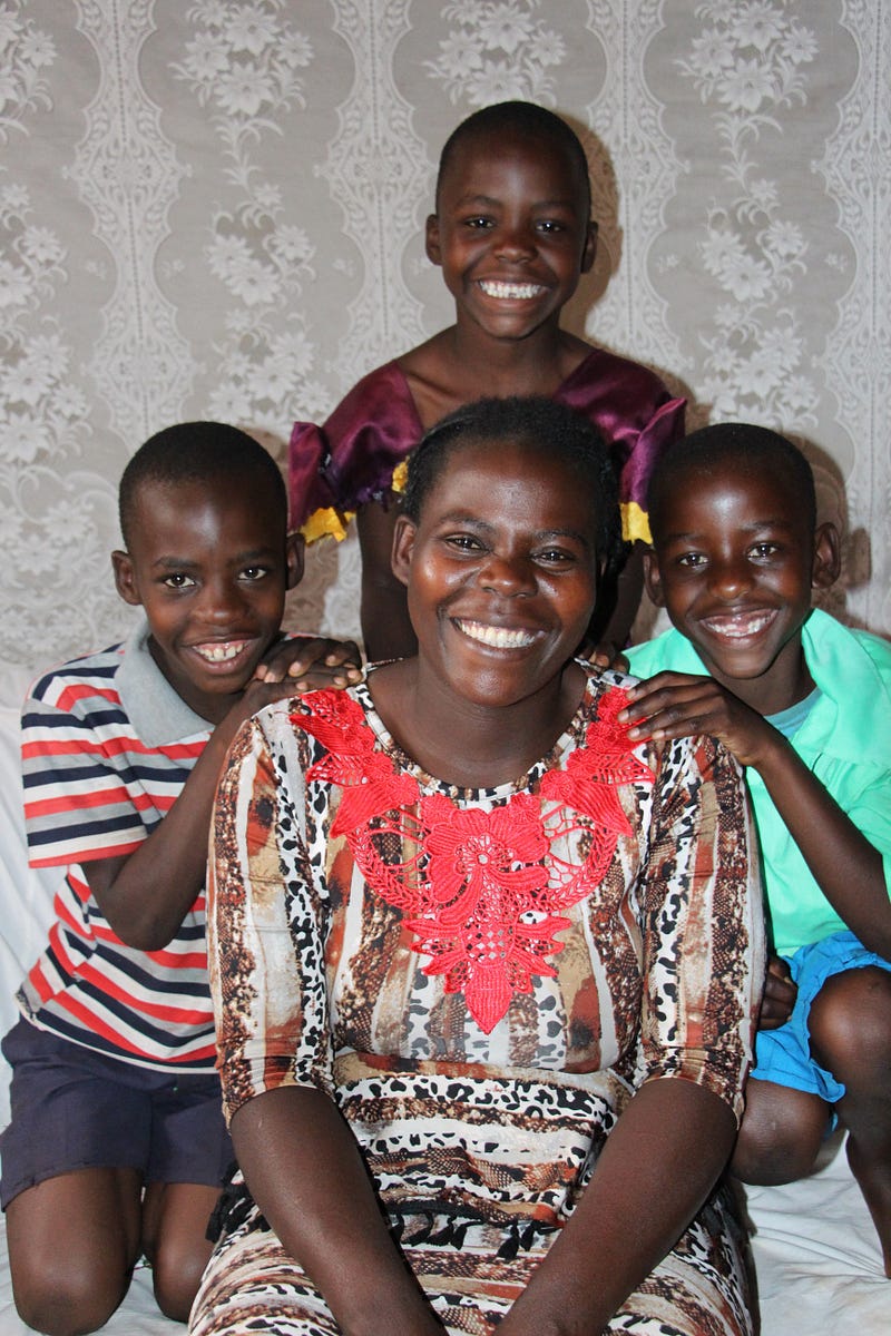 Village Enterprise business owner Lillian and her three children