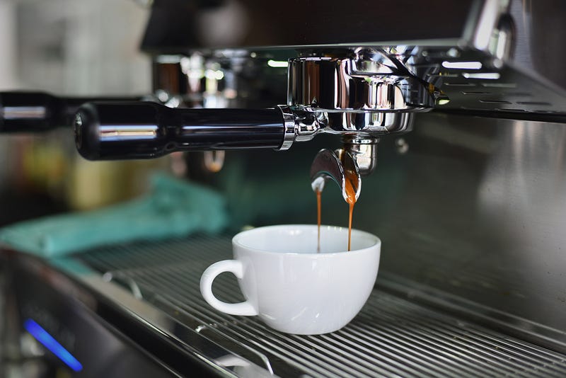 Espresso Machine pouring coffee in a cup