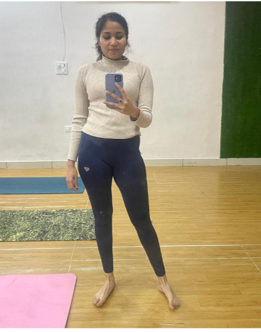 A woman taking a mirror selfie.