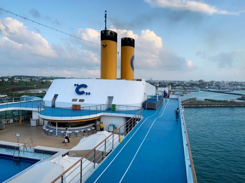 A cruise ship from Costa Cruise departs from the port of Miyakojima