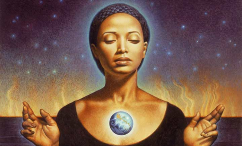 Headshot of a Black woman with her eyes closed and serene demeanor. She is wearing a purple hair wrap and a black swoop neck shirt. She has her two hands opened and outstretch by each shoulder. A blue, orange, and white planetary globe hoovers over her heart. A purple sky filled with stars is in the background, lingering above what appears to be soft flames emerging from a horizon of water.