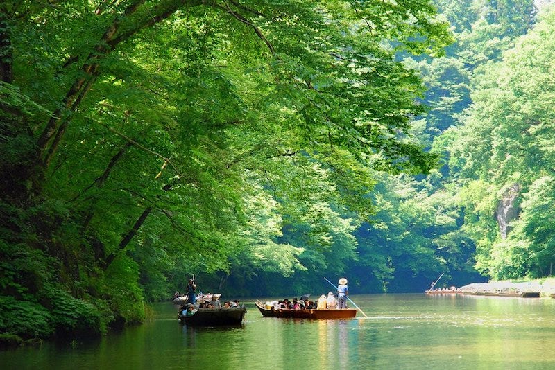 Boats travel down Iwate Prefecture’s Geibikei Gorge