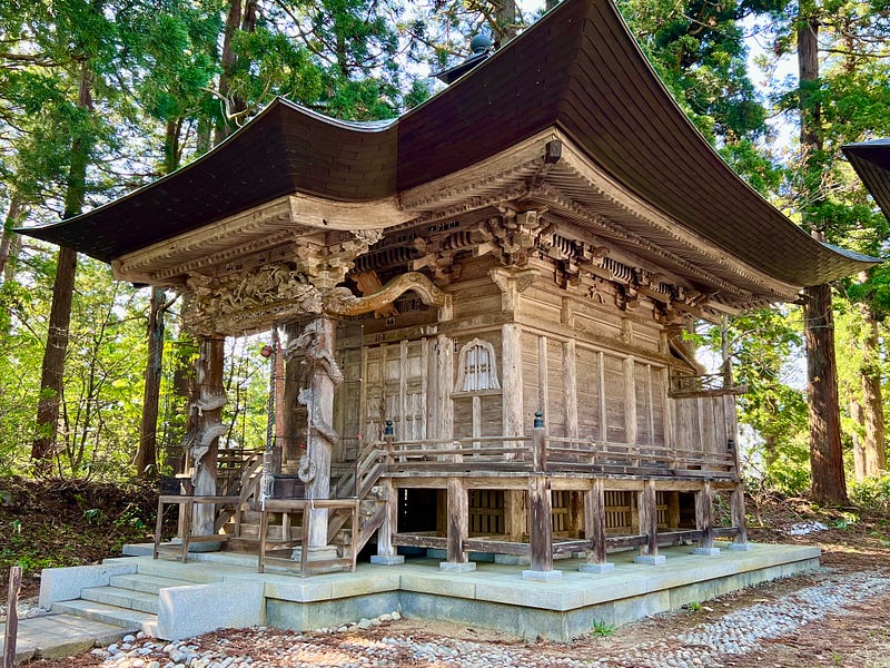 Wooden shrine decorated with intricate carvings, on the summit of Mount Haguro.