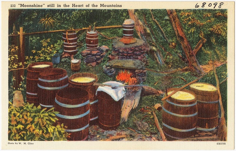 Color postcard of a moonshine still in the Appalachian mountains.