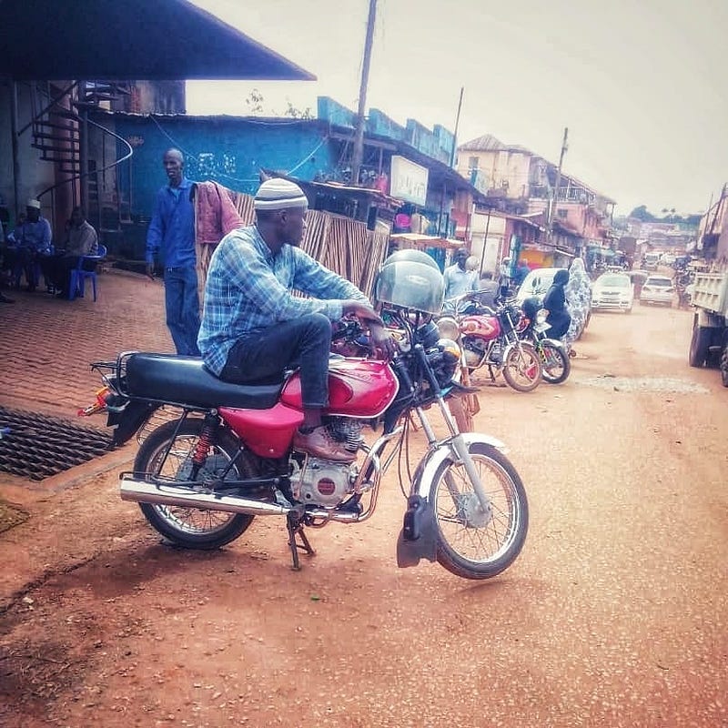 A driver waits for passengers near Owino market. Credit: Geofrey Ndhogezi.