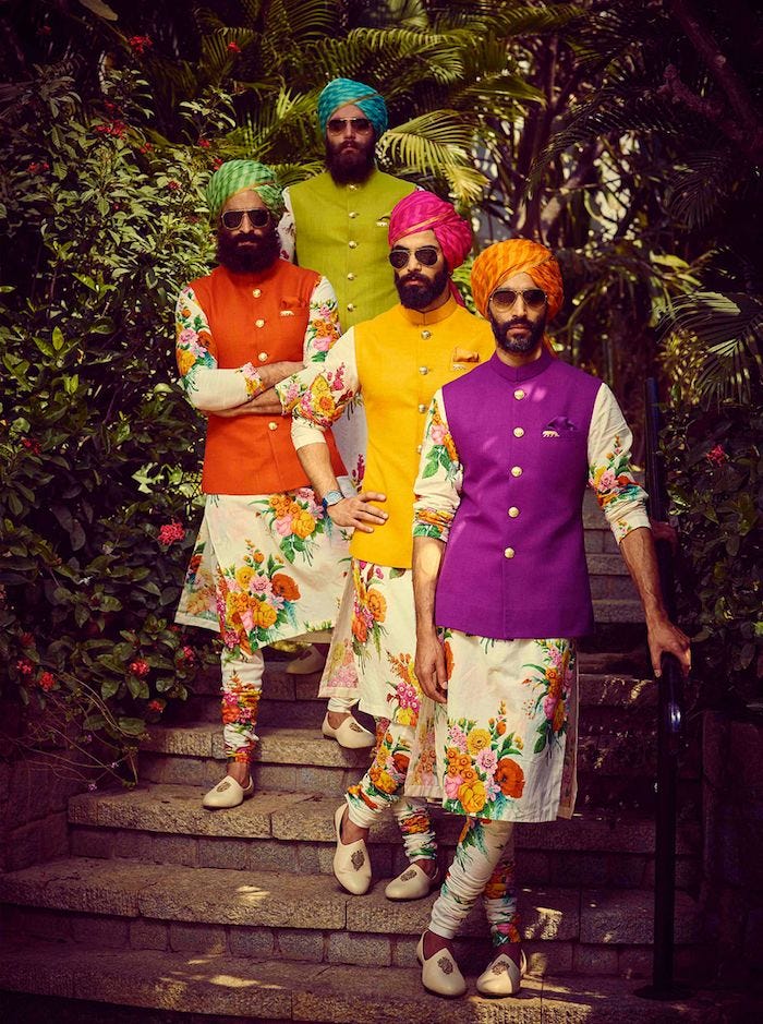 Men wearing floral printed kurtas with bright colored nehru jackets