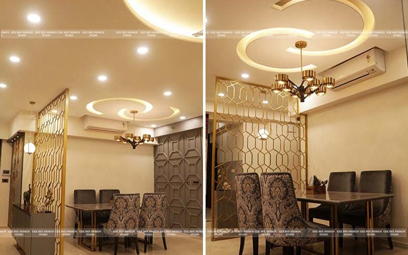 a well-lit dining room with a ceiling fan and a stylish dining table set for a meal