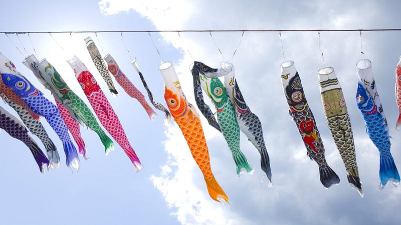 Carp streamers against a blue sky are decorations for Children's Day in Japan.