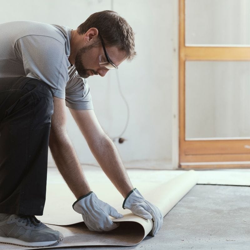 A contractor installing a new floor