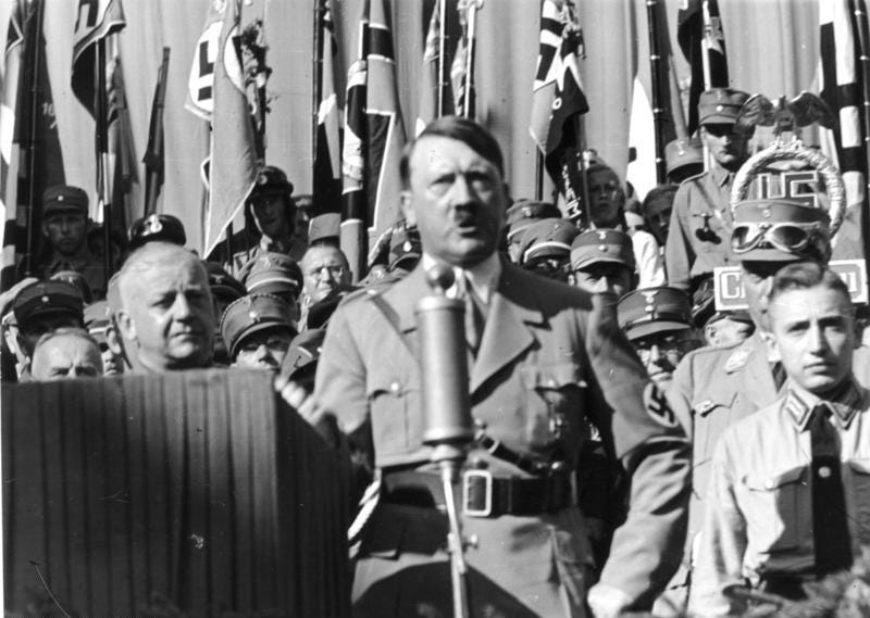 Adolf Hitler speaking at a local celebration of the NSDAP