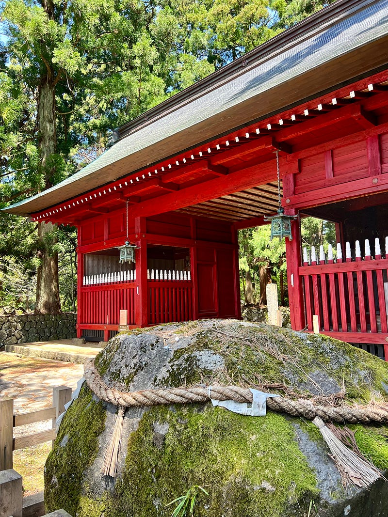 Red gate at the entrance to the Mount Haguro trail.