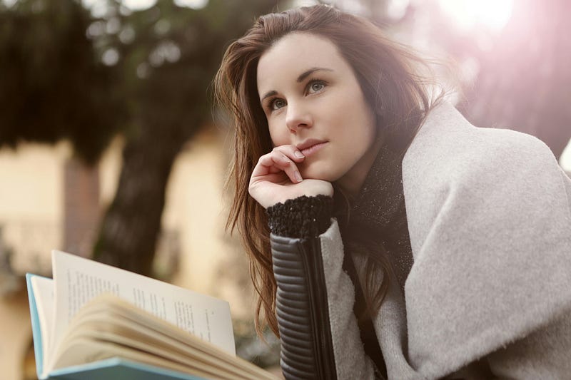 A woman reading a book.