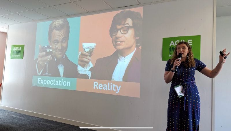 Holly in front of a slide showing Leonardo di Caprio with a martini and Austin Powers with a martini