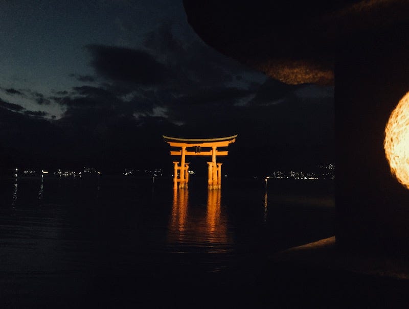 The iconic floating torii gate of Miyajima’s Itsukushima Shrine in Hiroshima Prefecture at night