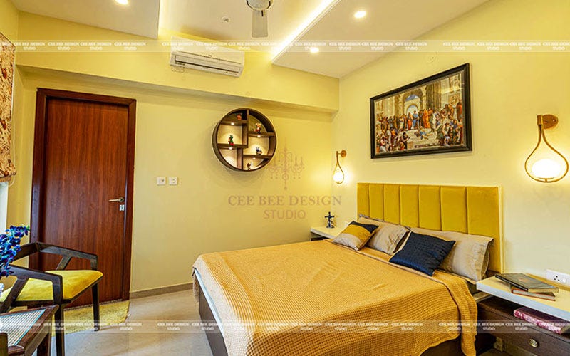 Bedroom with yellow walls and bedding, creating a warm and cozy atmosphere.