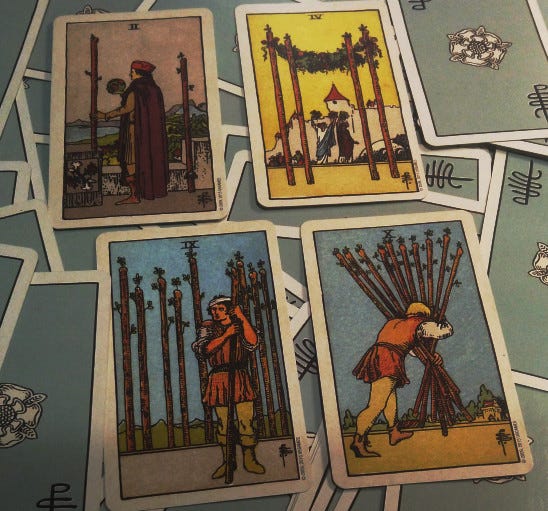Two, Four, Nine, Ten of wands are pictured