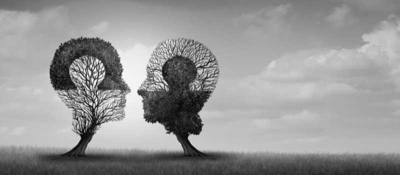 A grey-tone landscape with two trees shaped like human heads to illustrate the book extract from a “Suspicious Science” by Rami Gabriel.