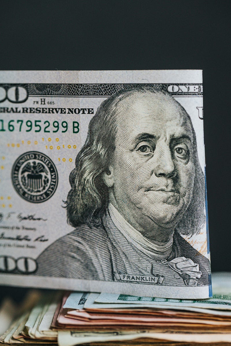 Ben Franklin on 100 dollar bill.