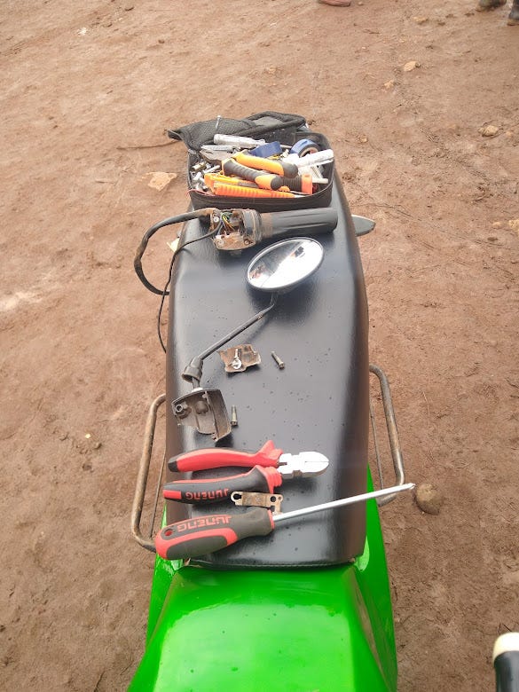 Tools of the trade: a breakdown in Kalerwe forced Lubyanza co-author Tom Courtright to spend an hour outside an abattoir waiting for the mechanic. He still finds the ride worth it.