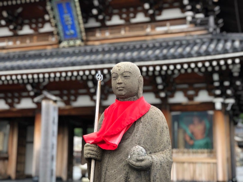 A statue of Jizo in front of Mt. Osore (Osorezan)’s Bodai-ji in Aomori Prefecture