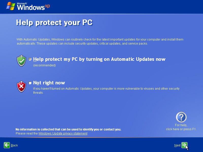 A screenshot of Windows XP’s OOBE on the “Help protect your PC” screen. It has text explaining the choice the user has to make and two options, protect the PC or not right now. These options are accompanied by colorful icons representing shields and the UI has additional options like asking for help or learning more about Microsoft’s policies