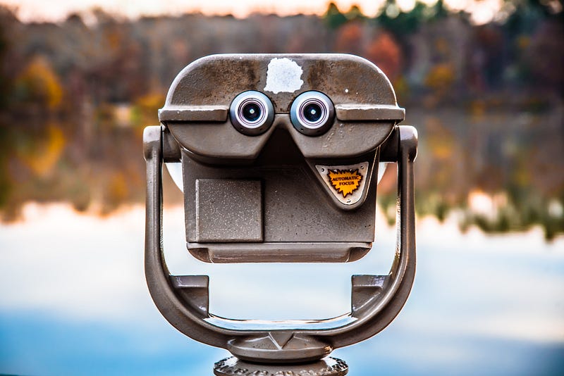 A viewfinder overlooking an autmn lake.