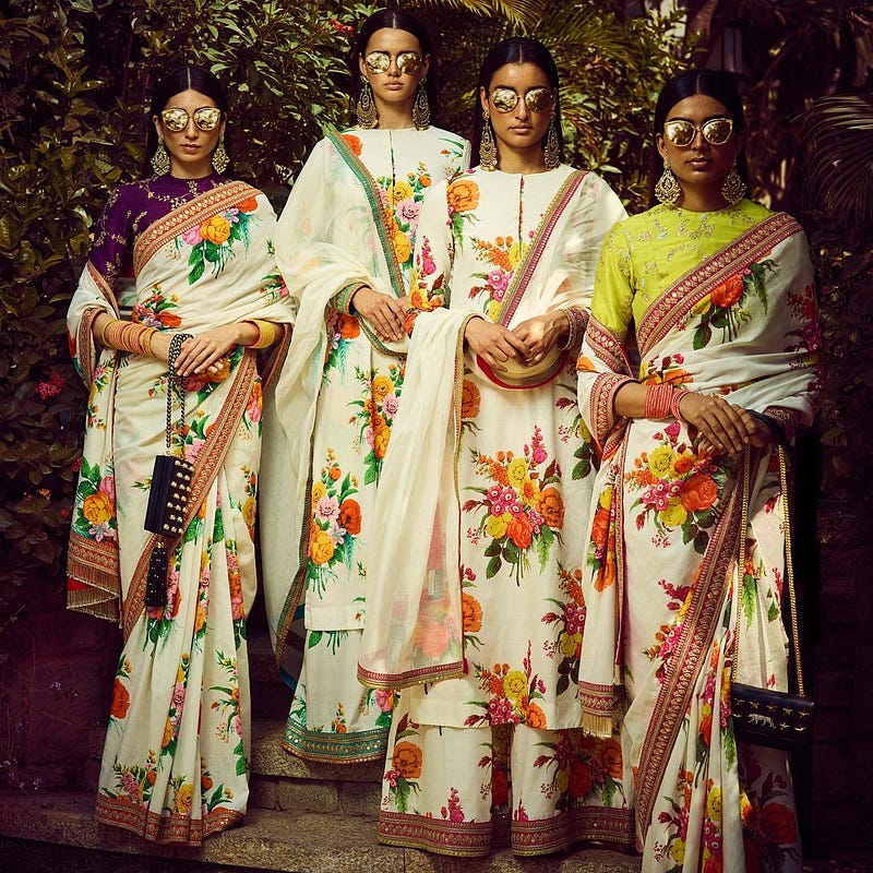 Ladies wearing floral printed sarees from Sabyasachi's collection
