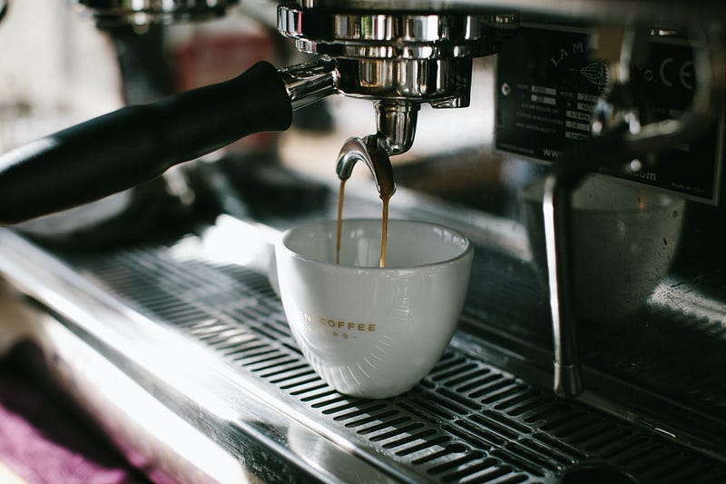 Home Espresso Machine pouring coffee in a cup