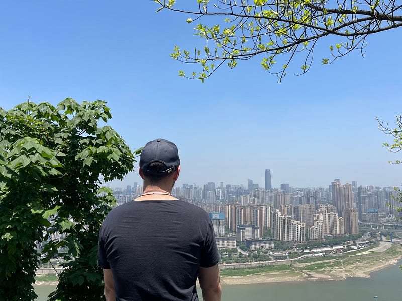Enjoying the beautiful scenery of downtown Chongqing on the top of Nanshan.