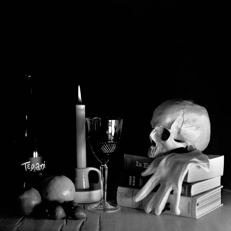 A black and white photograph of a memento mori-style scene lit with high power LED panels from the right hand side and front, creating a moody atmosphere
