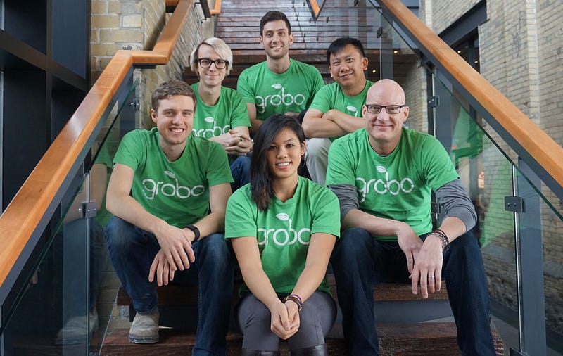 Image of the Grobo team sitting on a staircase.