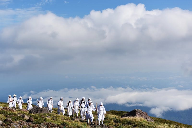 A group of yamabushi mountain travel across the top of Mt. Gassan in Yamagata Prefecture