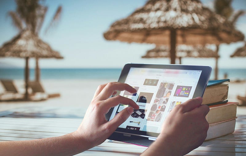 Using a tablet on a beach during summer vacation? Perfect holiday for some, a nightmare for others.