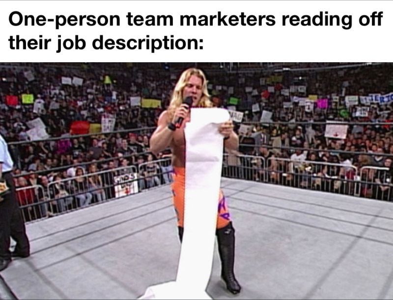 A wrestler reading a really, really long piece of paper. One person marketers reading their job description.