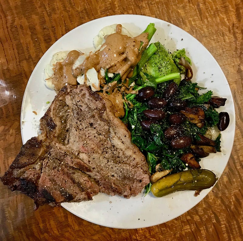 My first meal to break the fast. Steak, greens, olives, cauliflower, pickles and my favourite food, almond butter.
