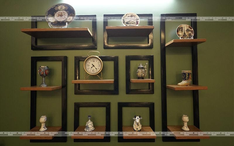 A wall with shelves displaying a variety of items.