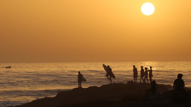 Surfers on the Devil’s Rock Tamraght