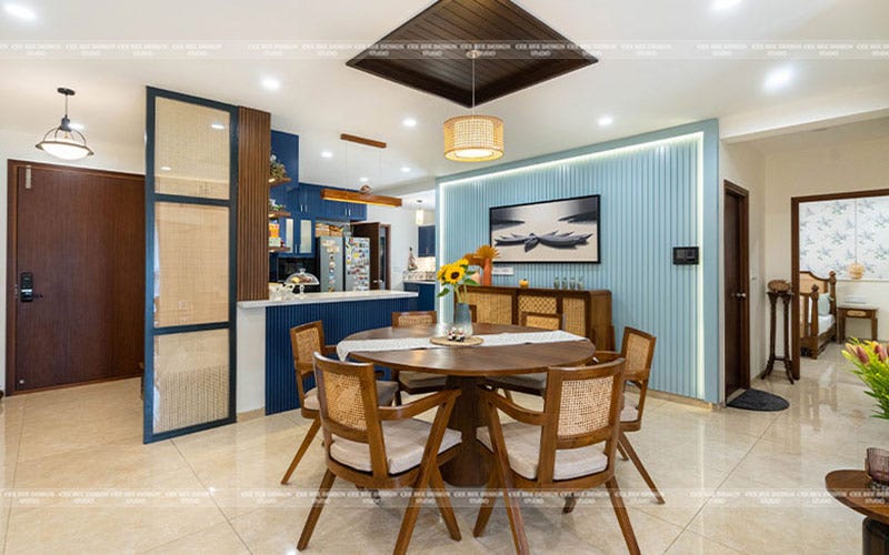 a dining room with a table and chairs