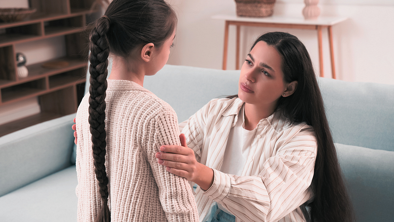 “Parent connecting with upset child — connect and redirect parenting”