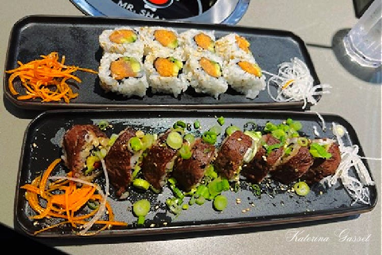 Photo of trays of sushi served at Mr. Shabu Hotpot and Sushi Restaurant located in Orem Utah, near Provo. Image by Katerina Gasset of the Gasset Group Real Estate Team, owner and author of the Move to Provo Utah website…